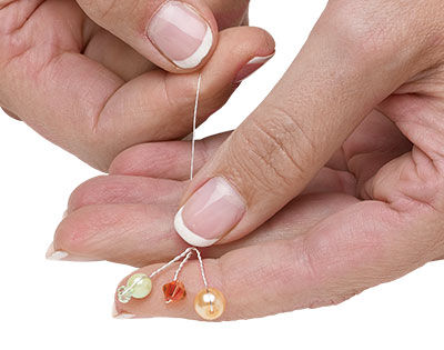 Twisting beaded wire together